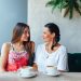 Two Women Talking In Cafe