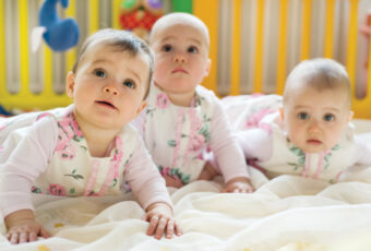 Sweet,Small,Triplets,Lying,In,Nursery,Room