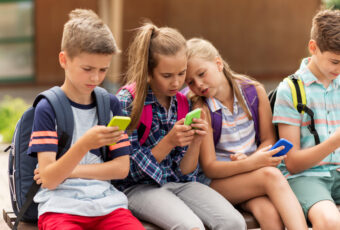 Elementary School Students With Smartphones