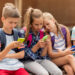 Elementary School Students With Smartphones