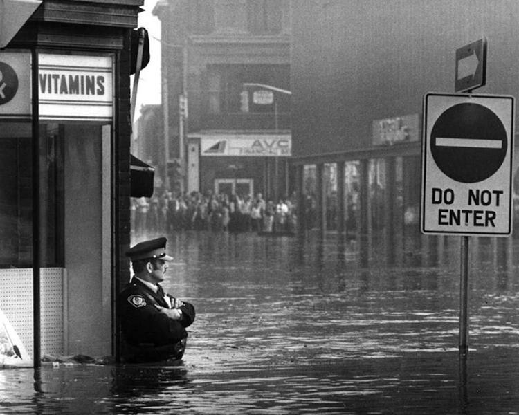 Police Officer In A Flood